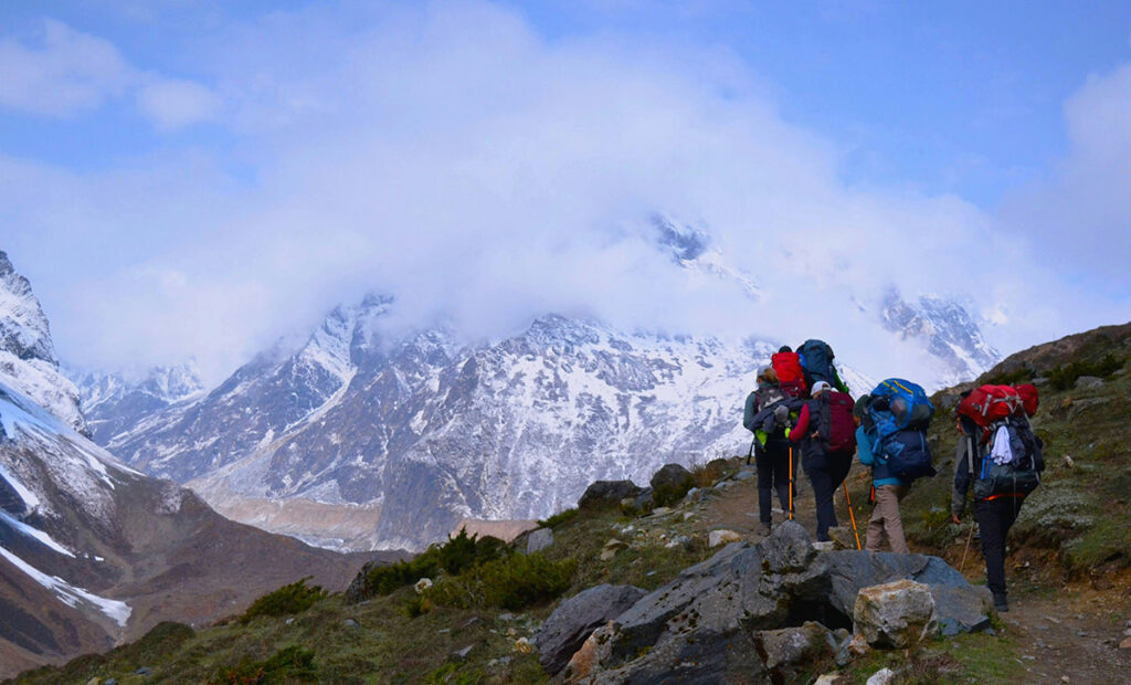 Group of people trekking in the mountains of Nepal