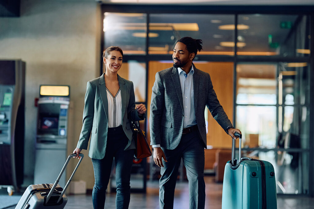 Man and woman with luggage at the airport
